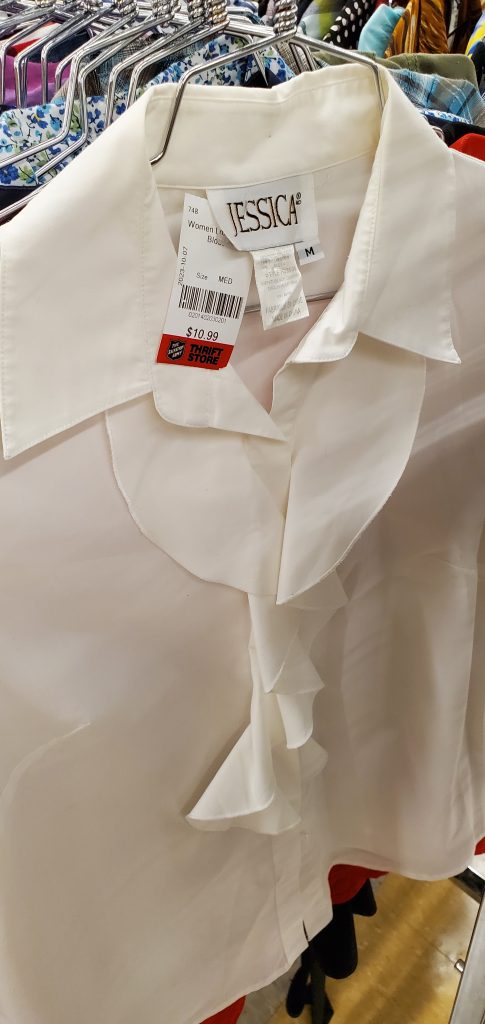 Charming white blouse adorned with a fashionable bow tie