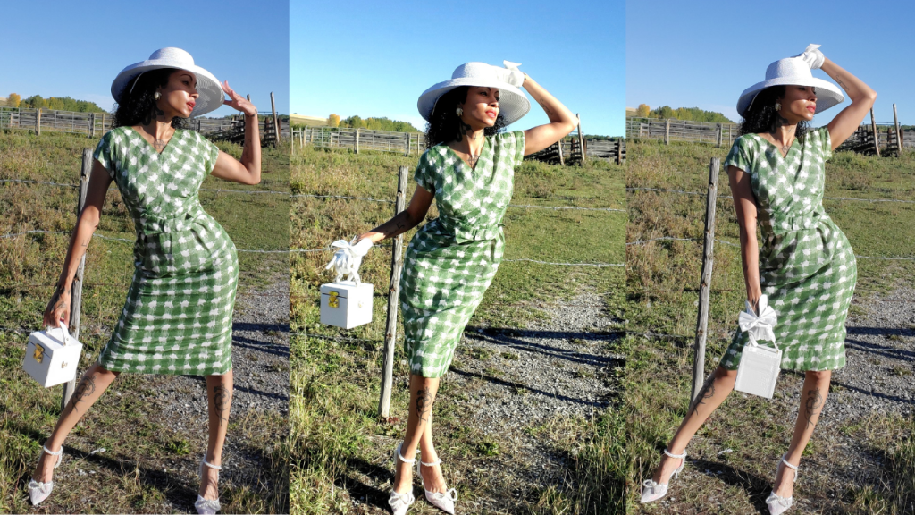 Graceful lady donning 1950s-inspired green & white checkered dress and hat, exuding retro glamour.